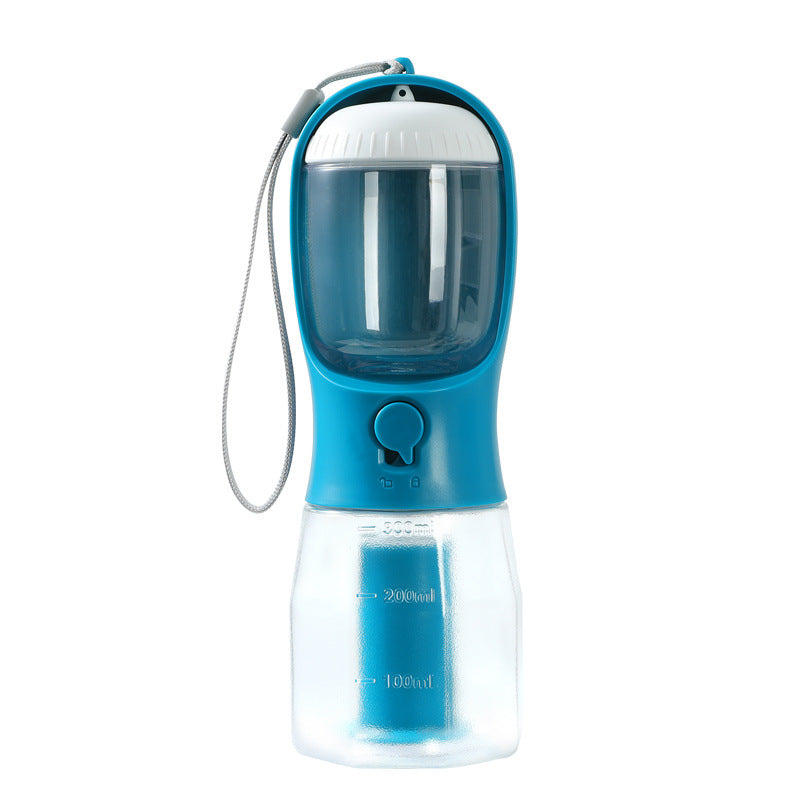 dog drinking from portable pet water bottle outdoors